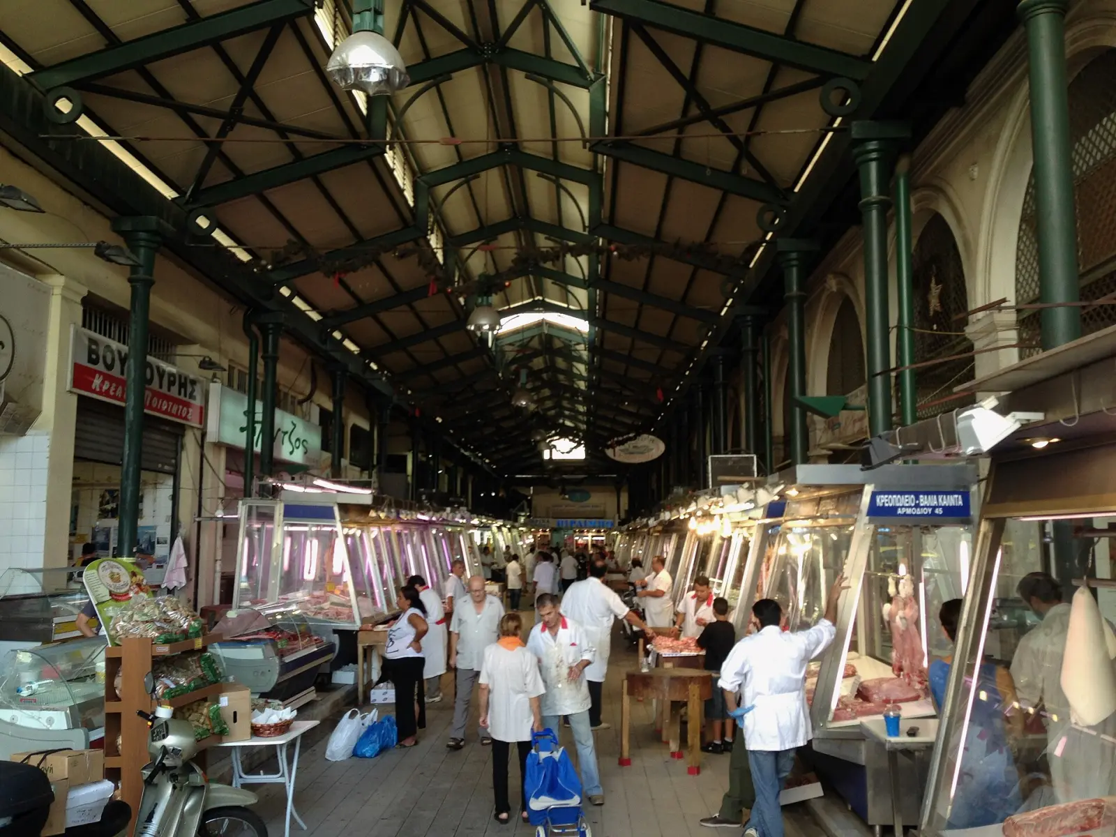 Inside the Varvakios central market in Athens, meat and fish stalls under the hall's arcades