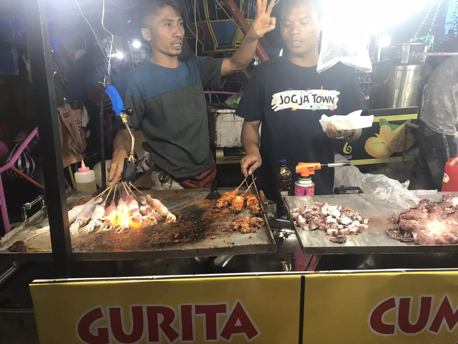 Food stalls lit up at the Ubud night market in Bali