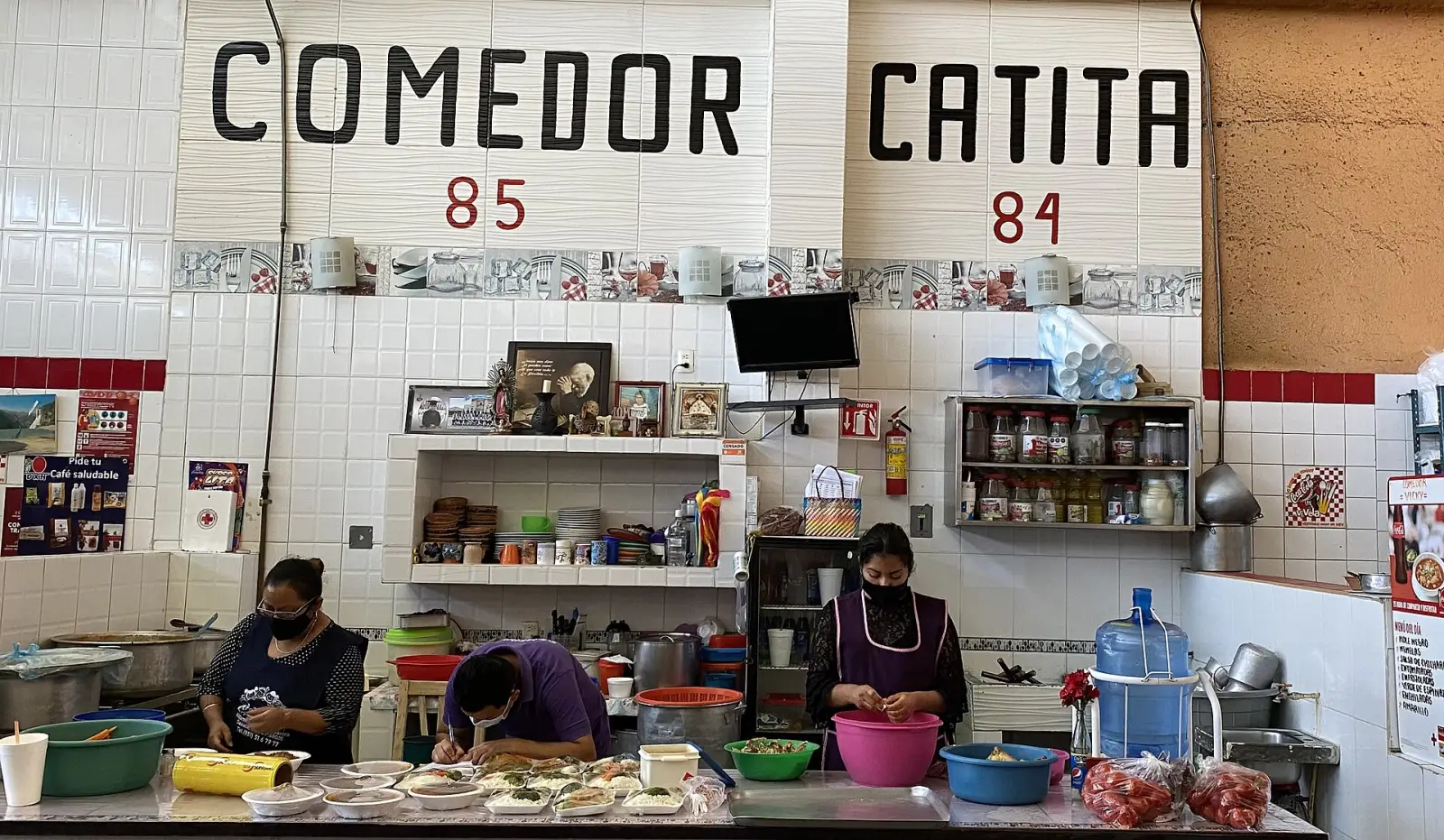 Food stalls and diners inside the 20 de Noviembre market in Oaxaca
