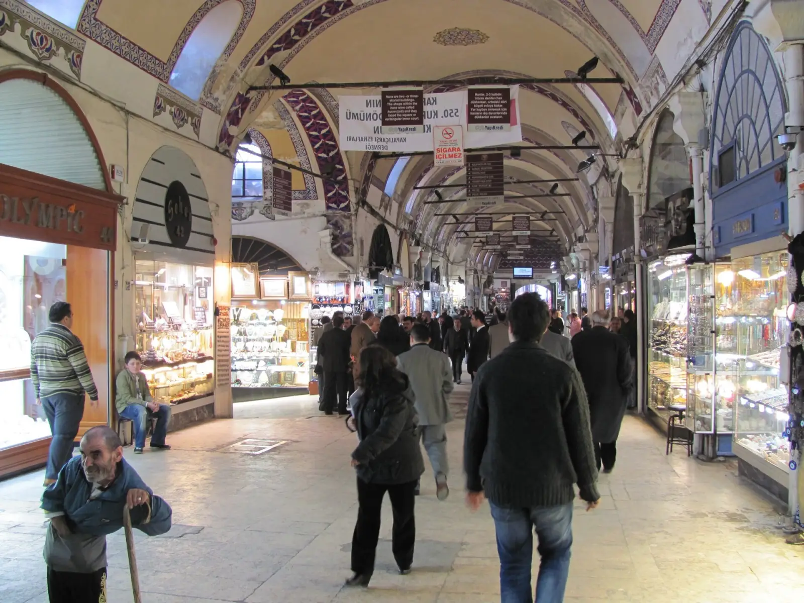 A vaulted lane of the Grand Bazaar in Istanbul lined with lamp and jewellery shops